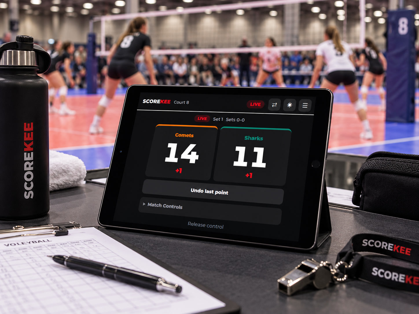 ScoreKee controller on a tablet for a different match: Comets 14, Sharks 11, with point buttons, Undo last point, and Match Controls.